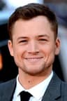 Portrait of Taron Egerton.